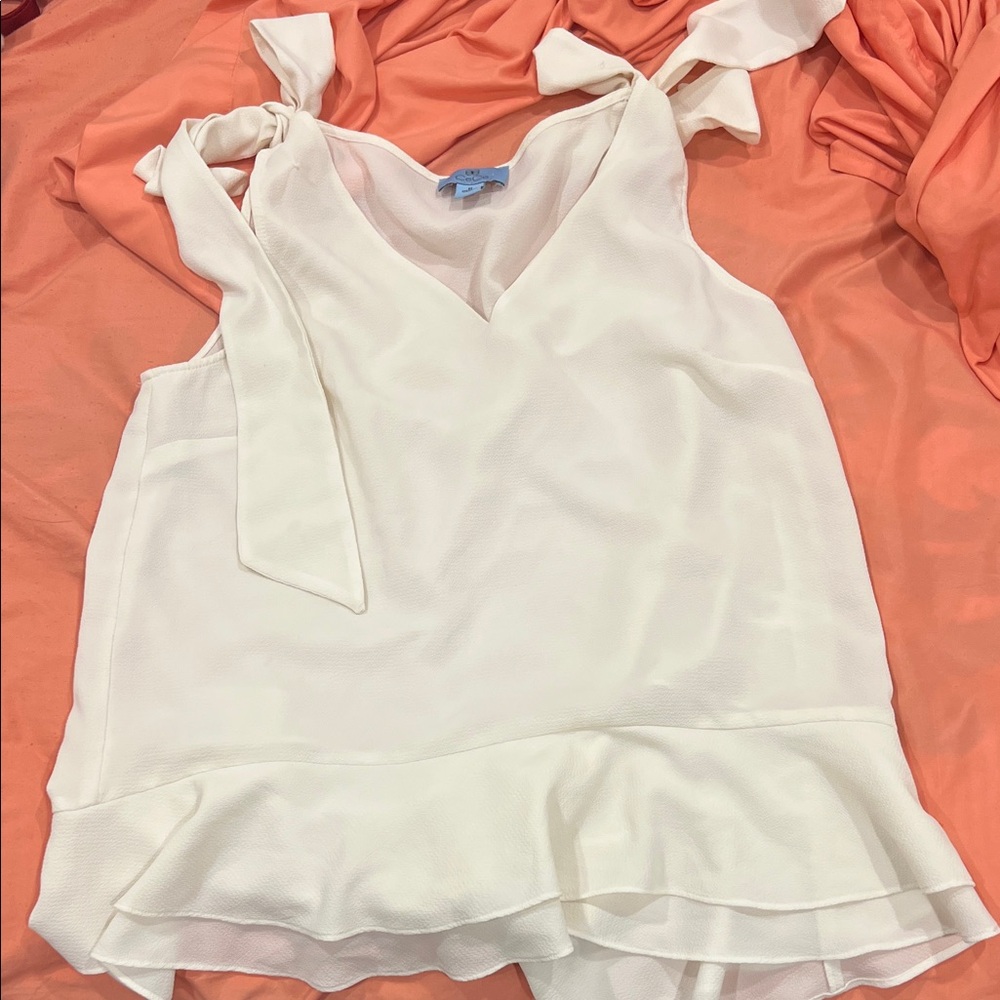 Cream Sleeveless Blouse with Ruffle Hem